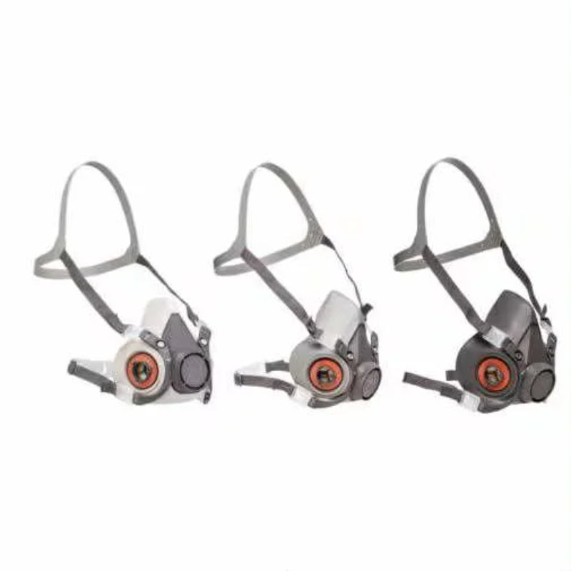 Three half-mask respirators on a white background