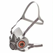 Half-mask respirator with gray strap on a white background